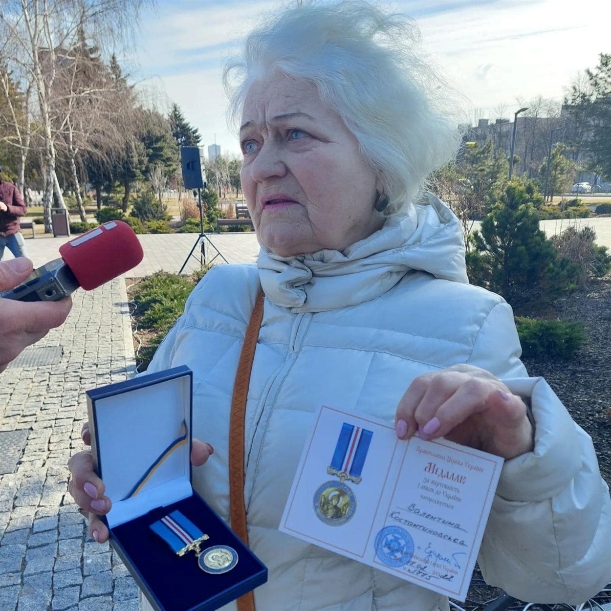 Valentyna Konstantynovska showing awards for her volunteer work. Credits: Valentyna’s archive