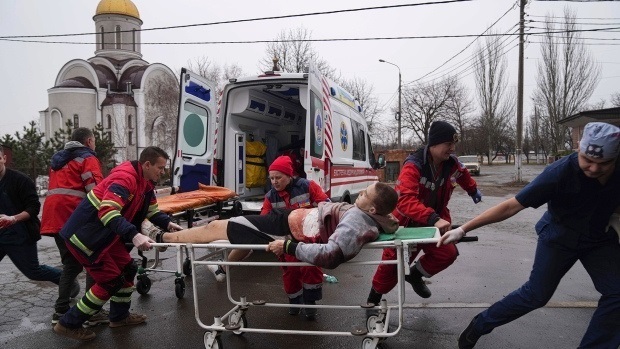 Serhiy (on the right) holding a wheel-stretcher.